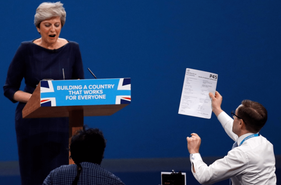  Theresa May is handed a P45 by prankster Simon Brodkin earlier today