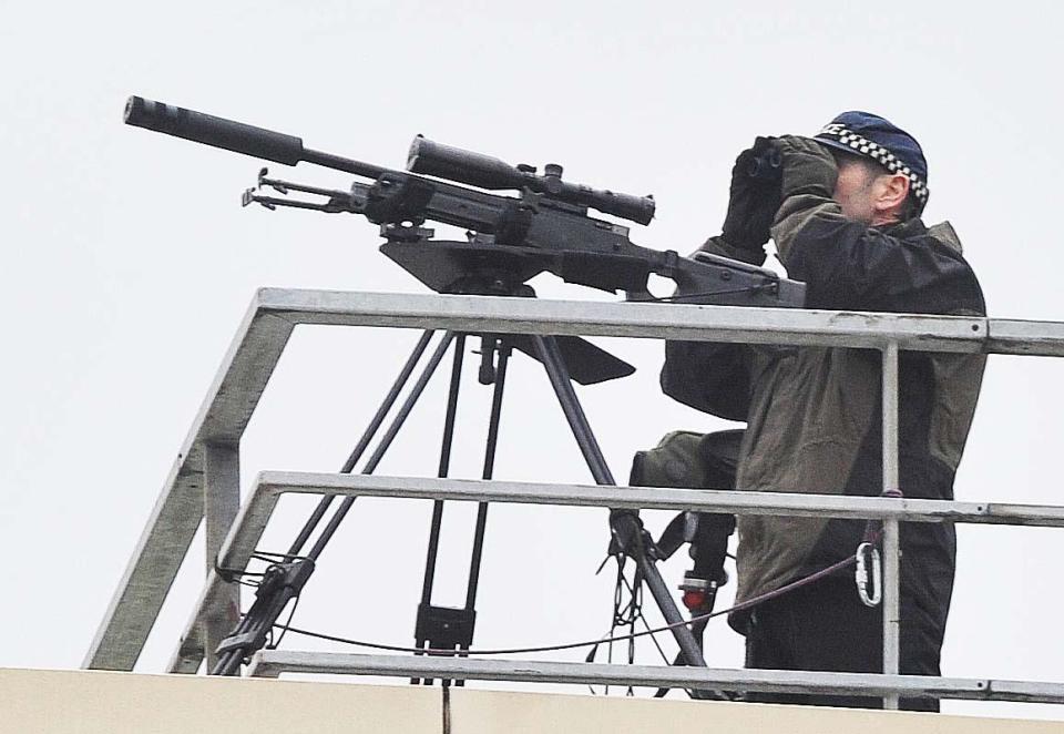  Police snipers kept a close watch on the march as it went through the town