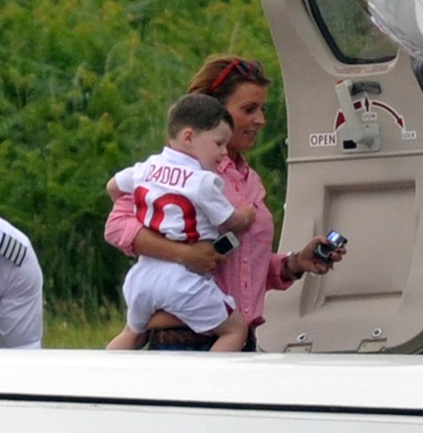  Coleen Rooney with her son on their way to the Euros in Poland in 2012