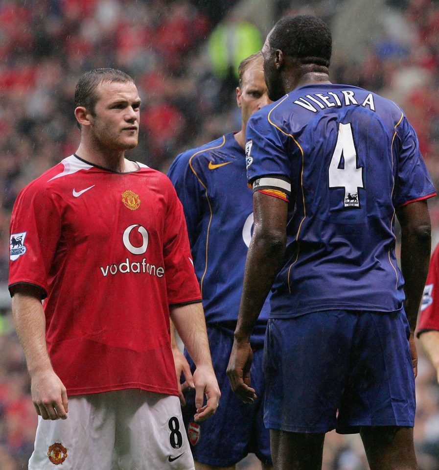 Rooney is surrounded by Arsenal star's in heated encounter