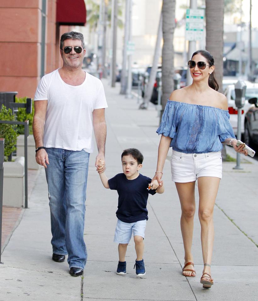  Simon Cowell pictured with his partner Lauren Silverman and Eric