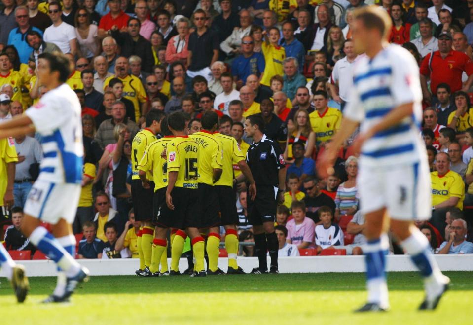  Watford's players surround the ref after the ghost goal