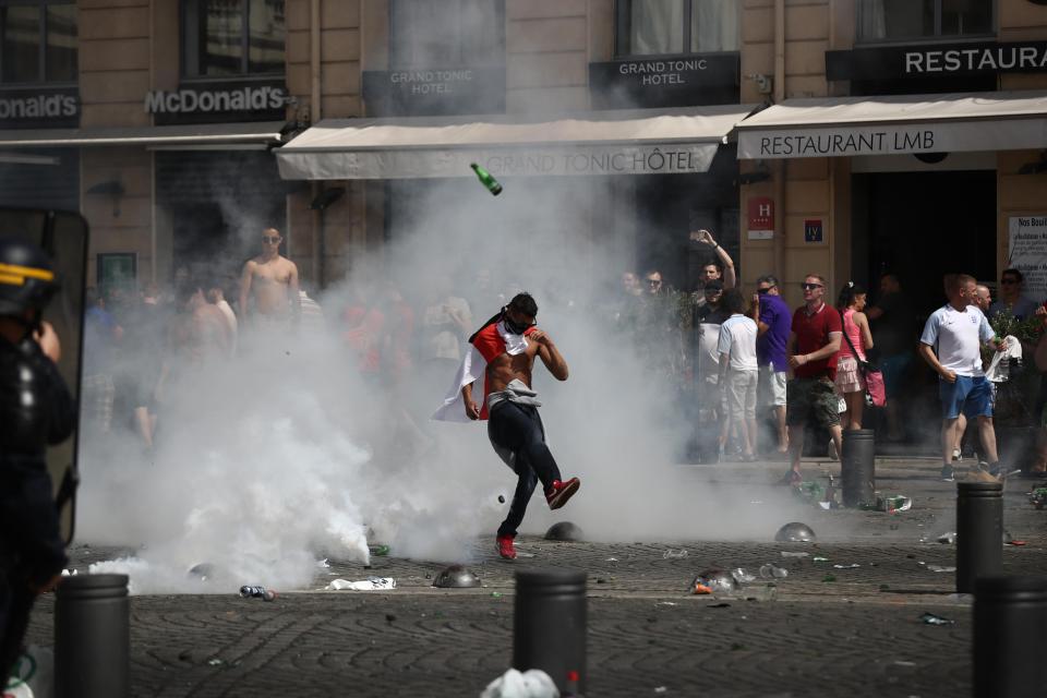  England fans react after police sprayed tear gas during clashes at Euro 2016 in France