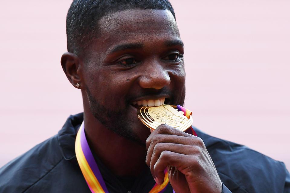 Jason Gatlin celebrates winning gold at IAAF World Championships in London, clocking a time of 9.92 seconds