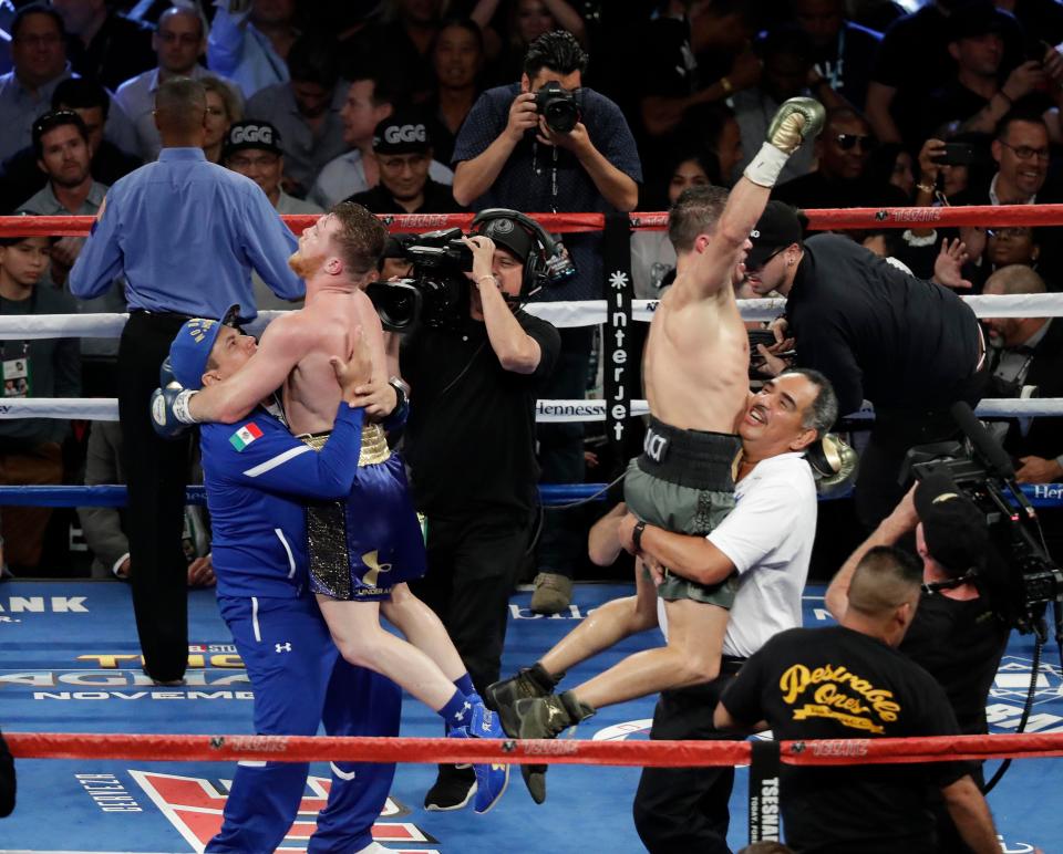  Gennady Golovkin (green trunks) and Canelo Alvarez (blue trunks) celebrate after the world middleweight boxing championship - but it would end in a draw