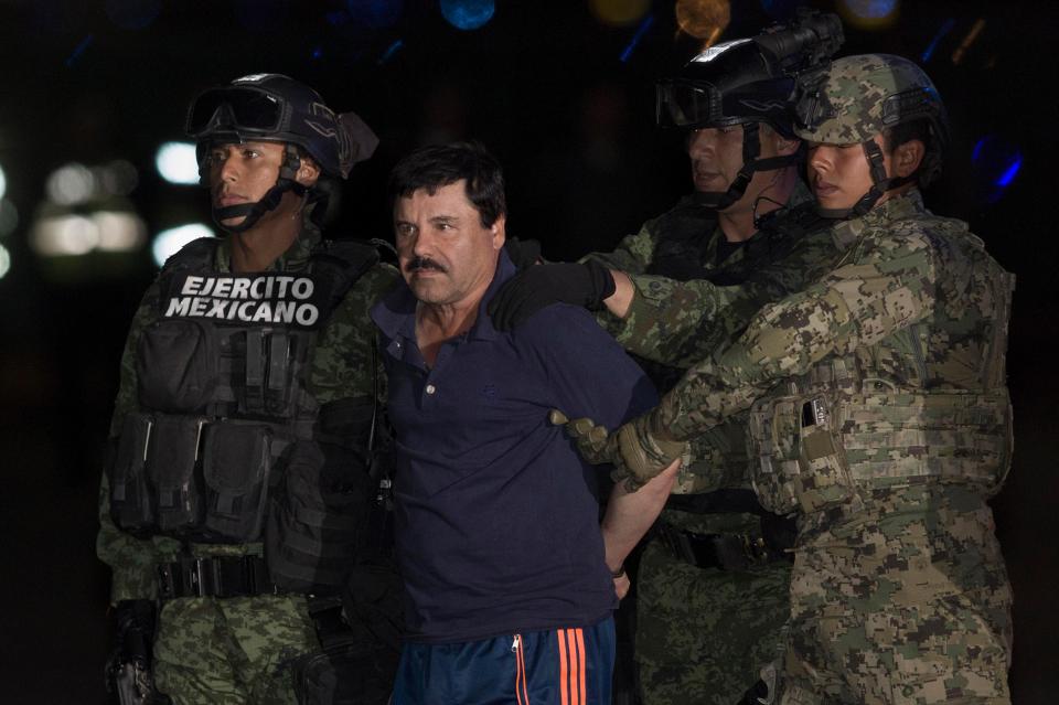 Soldiers escort El Chapo upon his arrival in Mexico City, after his arrest 