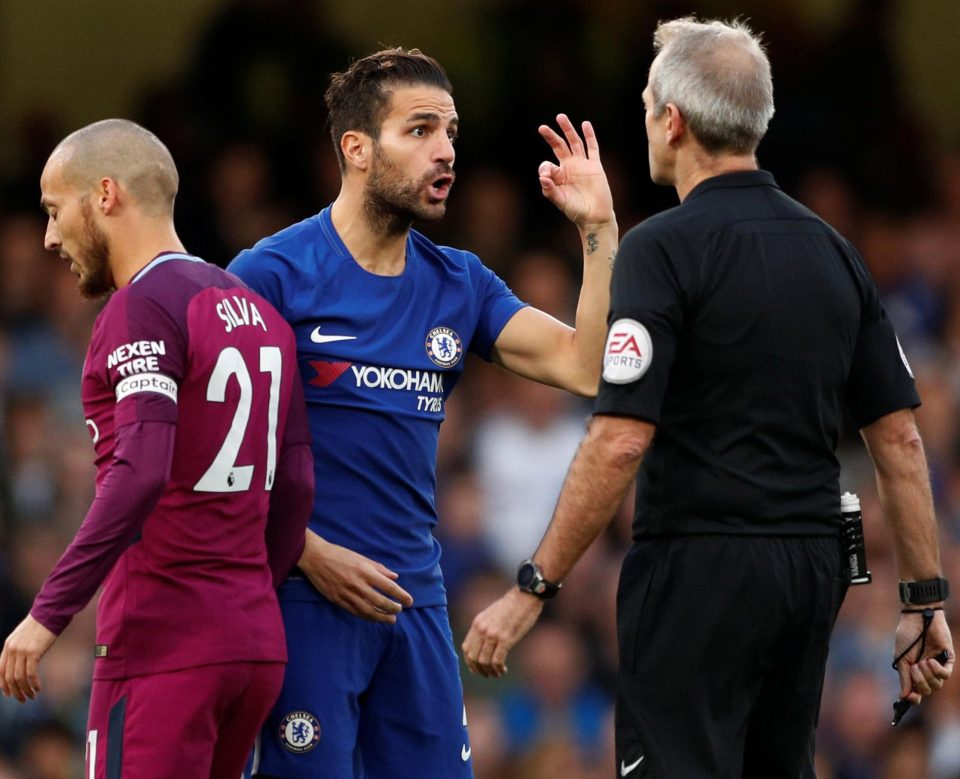  The Spanish midfielder argues the toss with ref Martin Atkinson