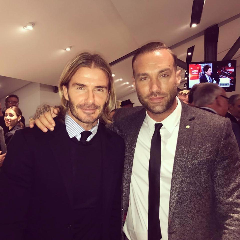 Beckham poses for a photo with Calum Best at Old Trafford