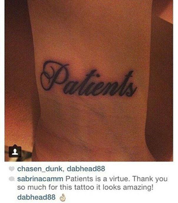  A woman shows off her 'patients' wrist tatt that we're guessing was meant to say 'patience'