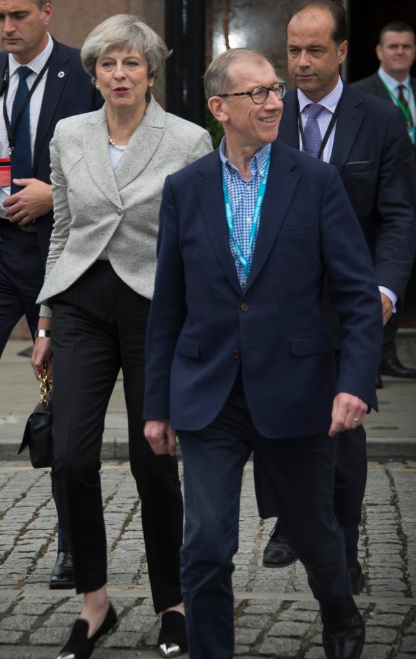  Theresa May arrives at the Conservative Party conference with her husband