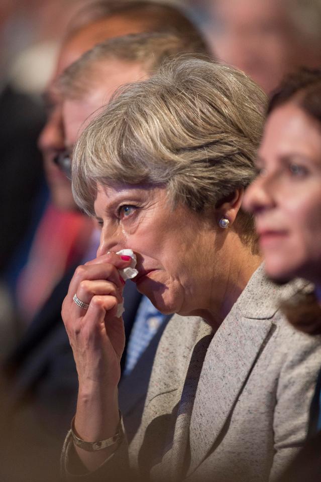  Theresa May struggles with a cold as she listens to speeches