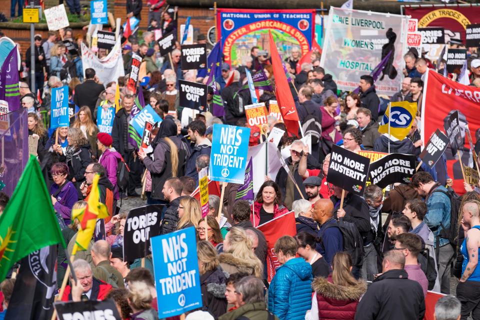  Hundreds waved placards and flags during the march on Sunday