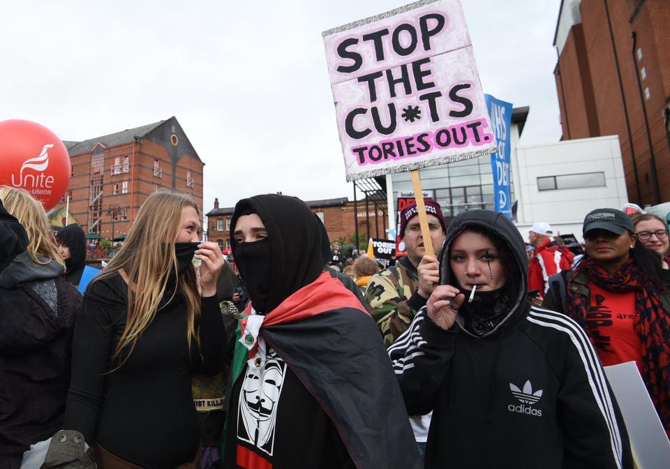  Some masked demonstrators marched along with the anti-Tory protest