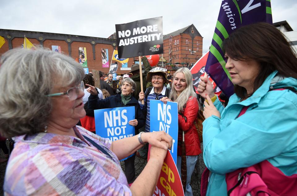  Protestors gather outside the venue to rally against the Conservative Party Conference