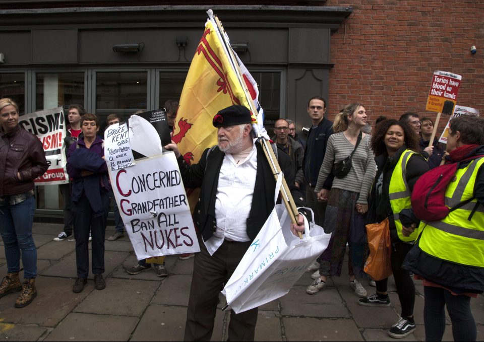  An anti-nuke protester waves a placard during the Manchester rally