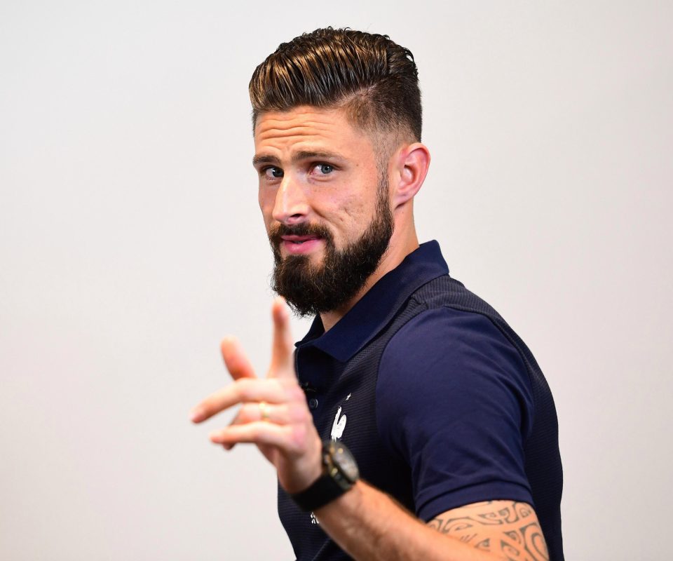  In a blue steel-esque picture, Giroud posed for the camera after his beard and eyebrows were tended to