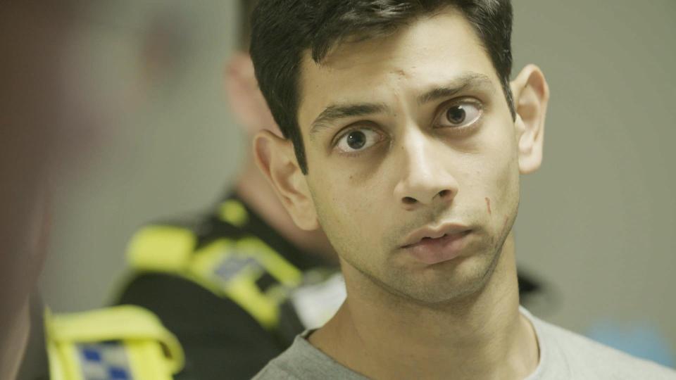  Suspect Harry Dhilllon arrives in the custody suite after an ITV documentary crew filmed his arrest