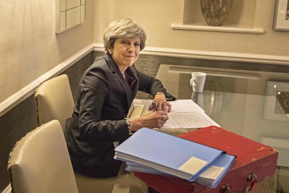  Theresa May all smiles as she prepares her conference speech