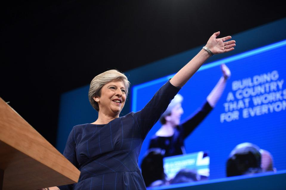  Theresa May on stage delivering her Tory conference speech