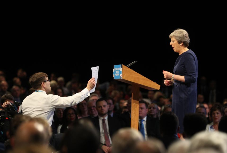  The PM was approached by prankster Simon Brodkin while she was speaking