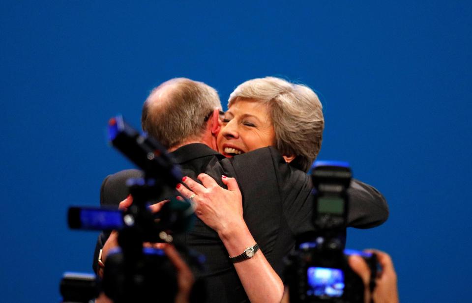  Mrs May smiled as husband Philip embraced her at the end of the speech