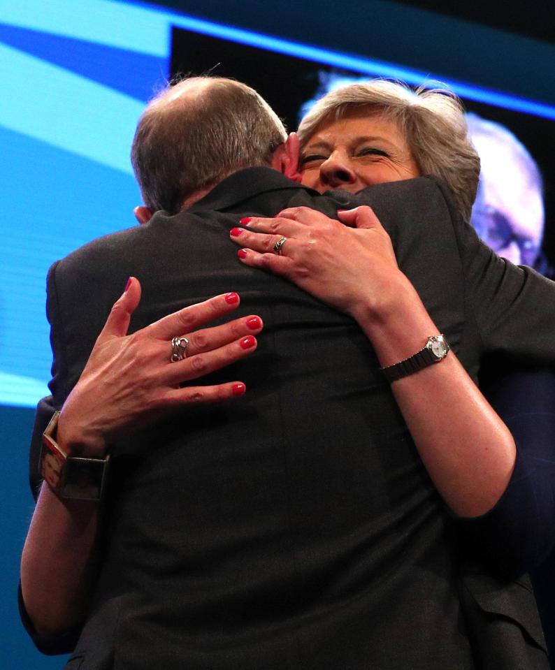  Husband Philip gives Mrs May a well-needed hug and tells her he's 'proud'