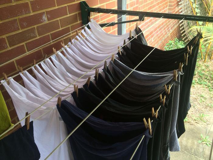  Stacking your T-shirts across the line rather than along it will give you more hanger space