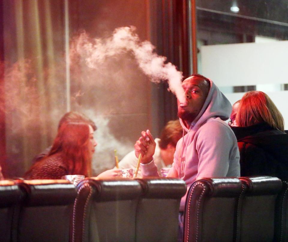 Usain Bolt has been spotted puffing on a shisha pipe