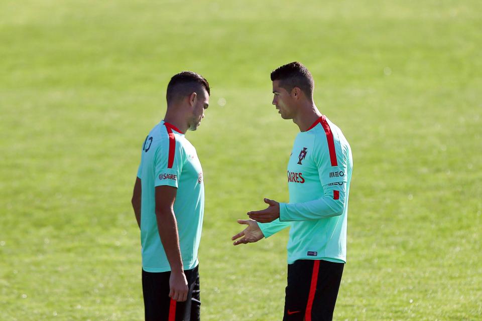  It's then time for Cristiano Ronaldo to discuss some tactics with centre-half Pepe