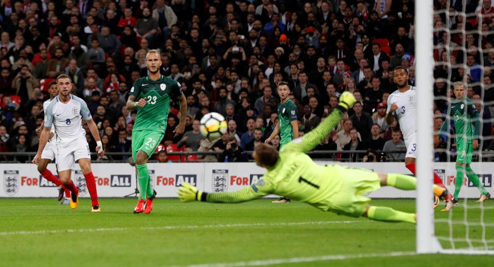 Jan Oblak saves a shot from England’s Jordan Henderson 