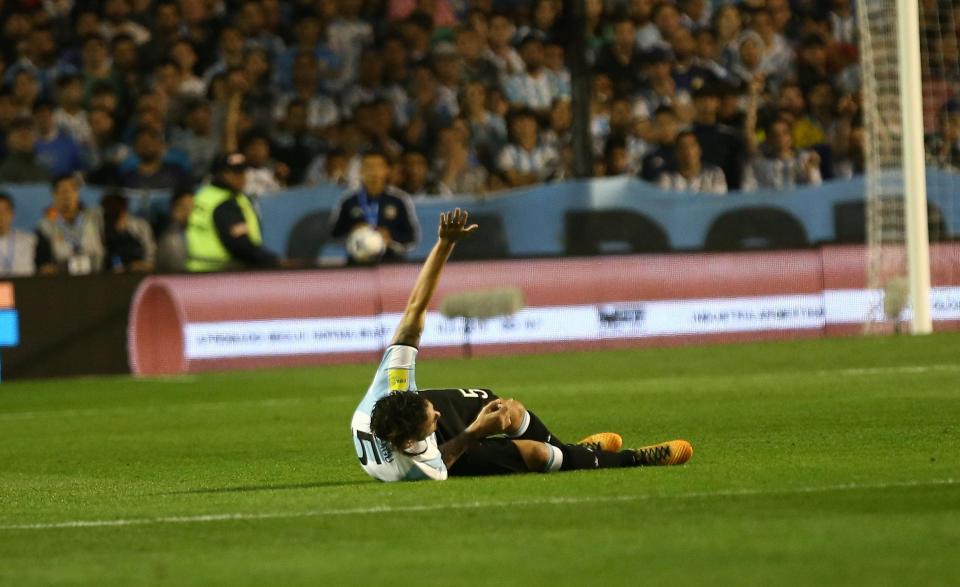  Fernando Gago lies stricken on the pitch after rupturing knee ligaments