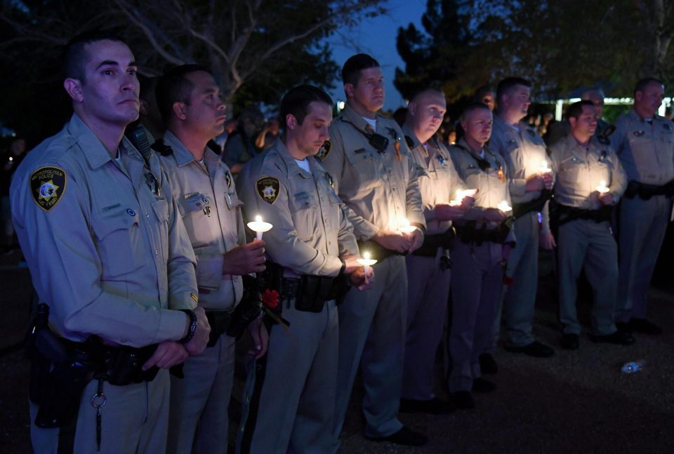  Colleagues of the fallen officer held candles in tribute