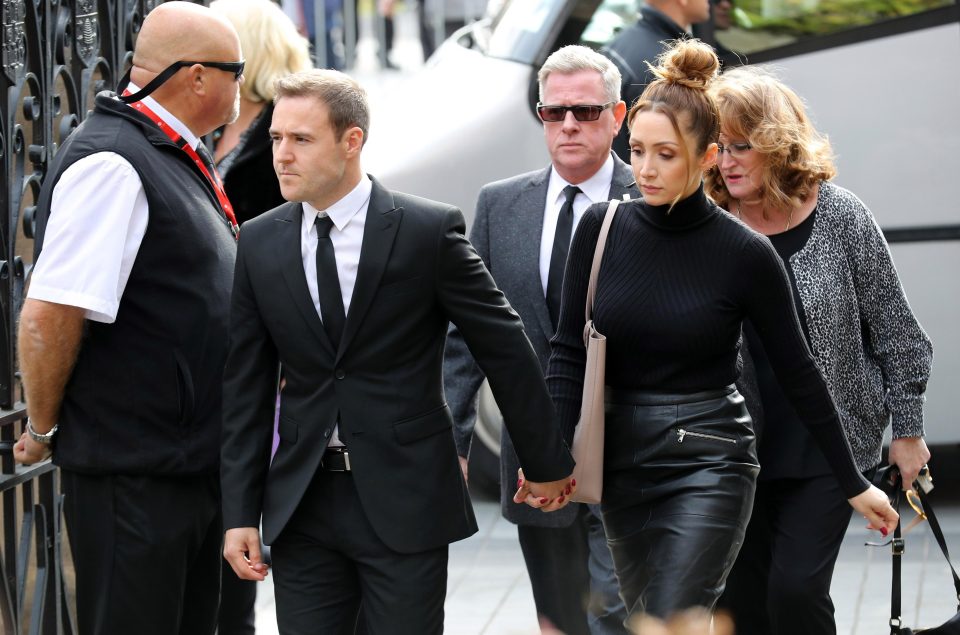  The couple clung onto each other outside the cathedral