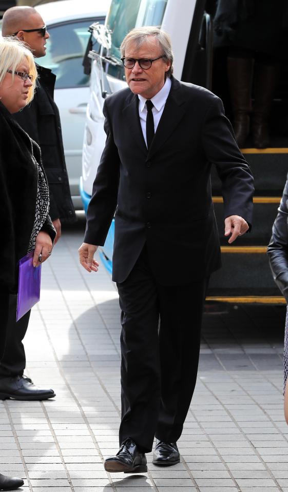  The actor looked smart in a black suit - a big change from Roy's usual attire