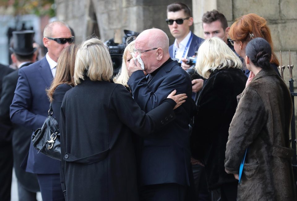  Liz's distressed husband Donald Ibbetson was consoled by friends and family outside