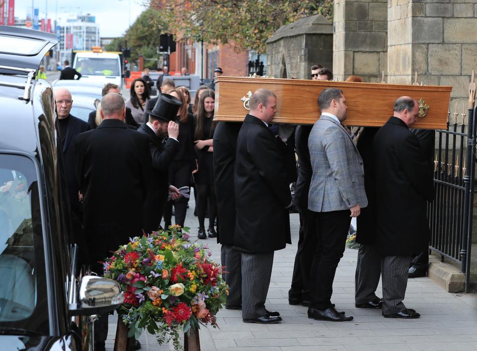  It was an emotional moment as the pallbearers took the coffin inside