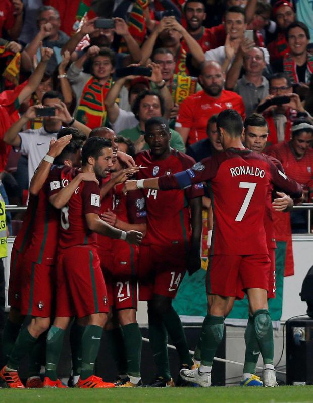 The Portugal players celebrate after getting that all-important opening goal