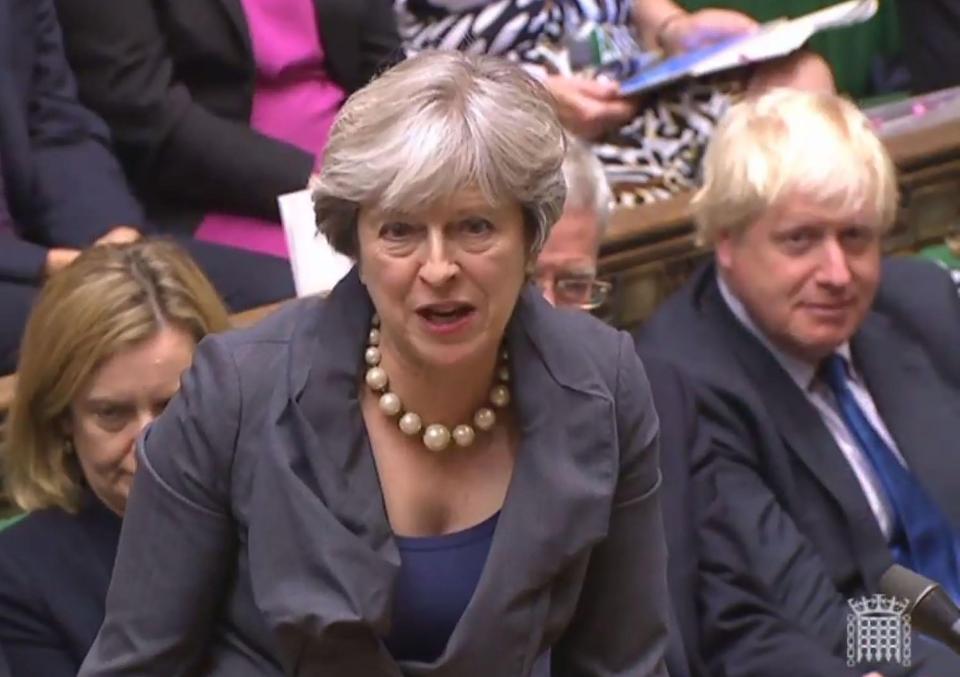  Theresa May defended universal credit but cancelled a 55p per minute helpline