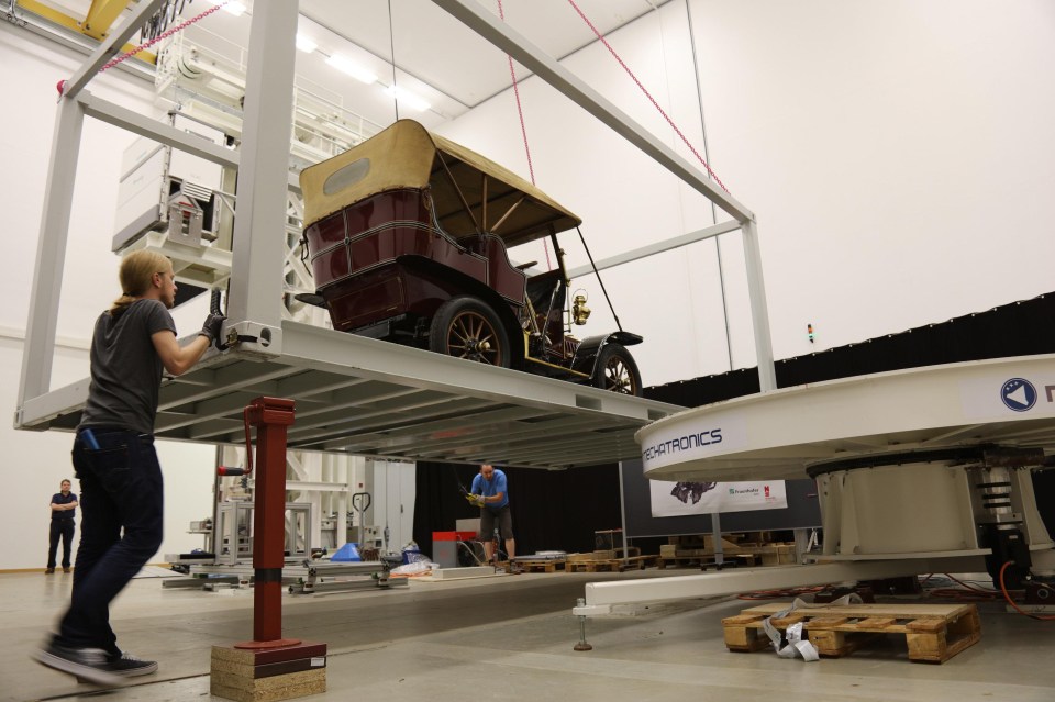 Here the 1907 De Dion Bouton is lifted in position for the x-ray to be taken