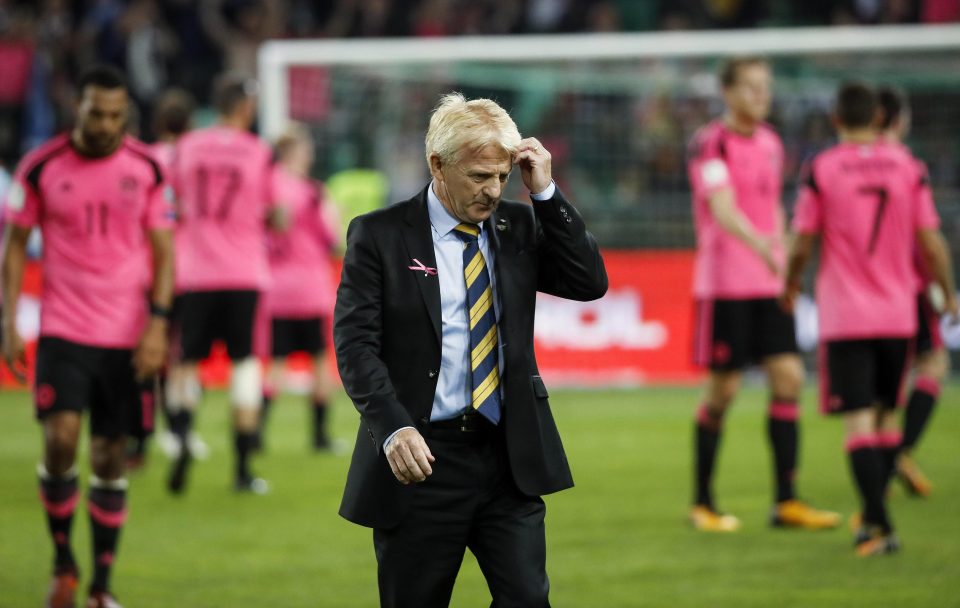  The former Scotland boss leaves the pitch after defeat to Slovenia