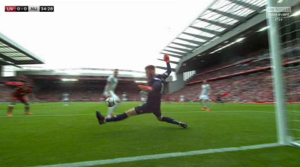  David De Gea somehow reacts to keep out Joel Matip's shot