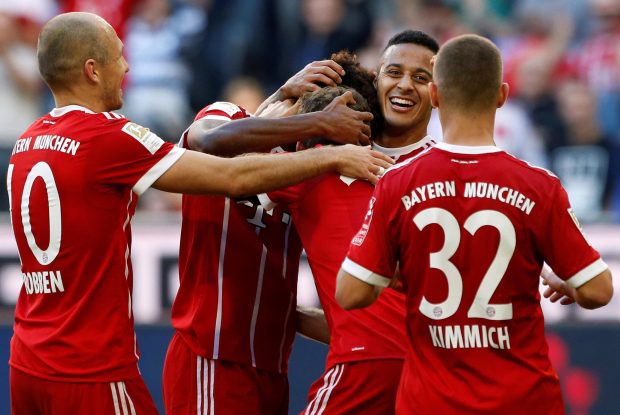 Kingsley Coman celebrates doubling the Bayern lead with Thiago Alcantara, Arjen Robben and Joshua Kimmich