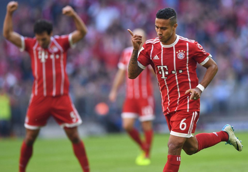 Thiago Alcantara enjoys bagging the third goal for champs Bayern