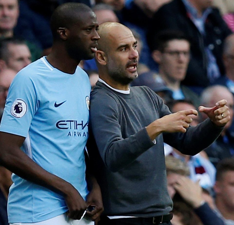  Guardiola issues instructions to Yaya Toure during the 7-2 demolition of Stoke