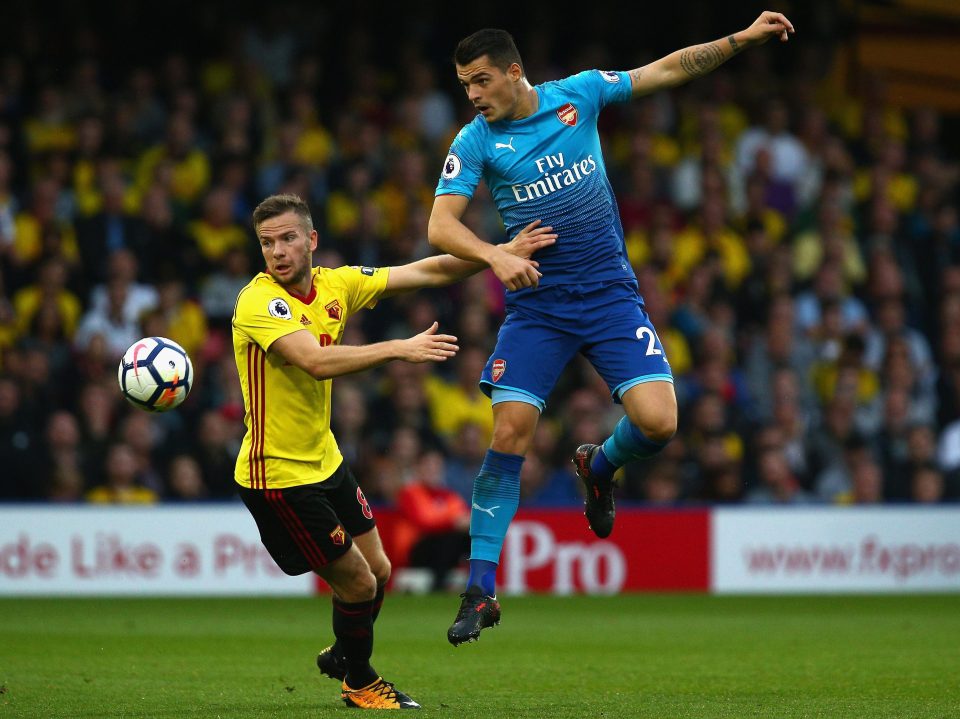 Granit Xhaka has been caught out picking his nose instead of tracking the run of Tom Cleverley