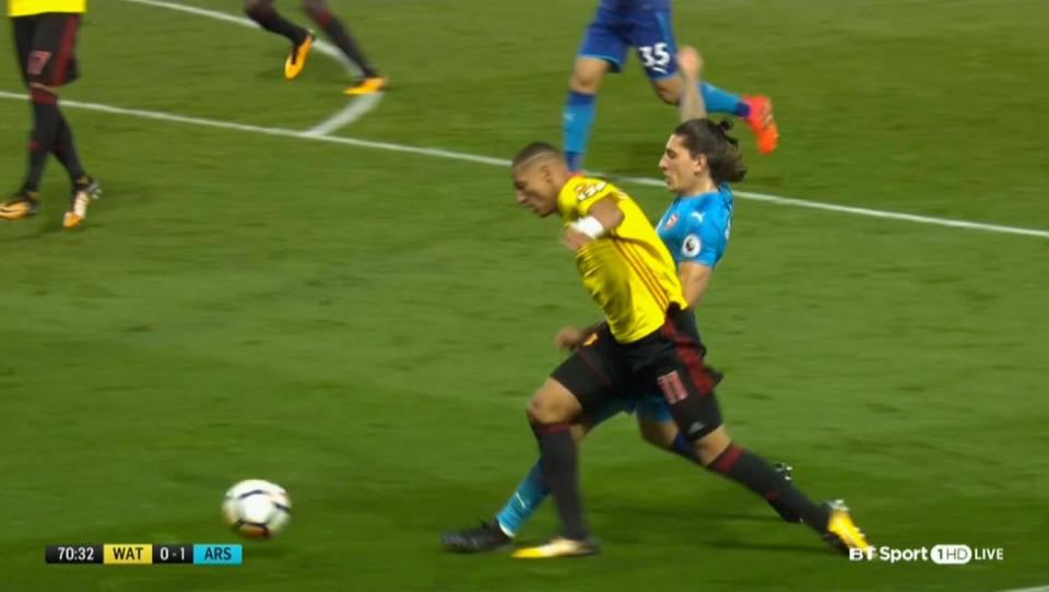  Richarlison went down after the challenge from Hector Bellerin