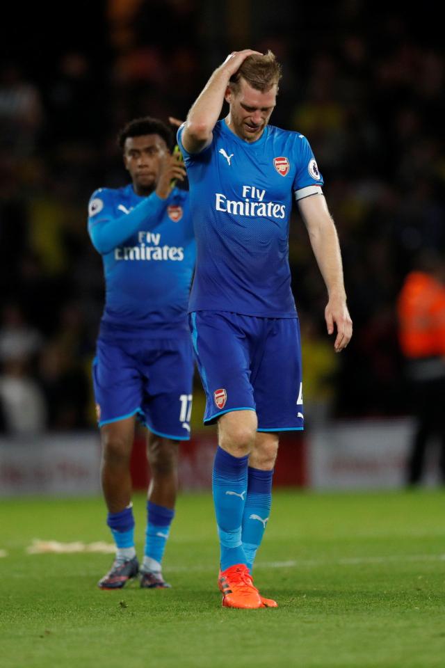  Goalscorer Per Mertesacker looks dejected at the full-time whistle at Vicarage Road