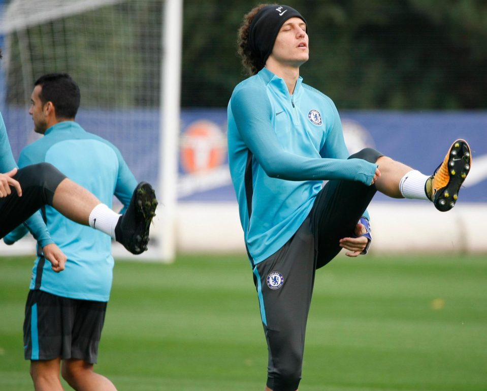  Blues defender David Luiz gets into the swing of training before the tie with Roma