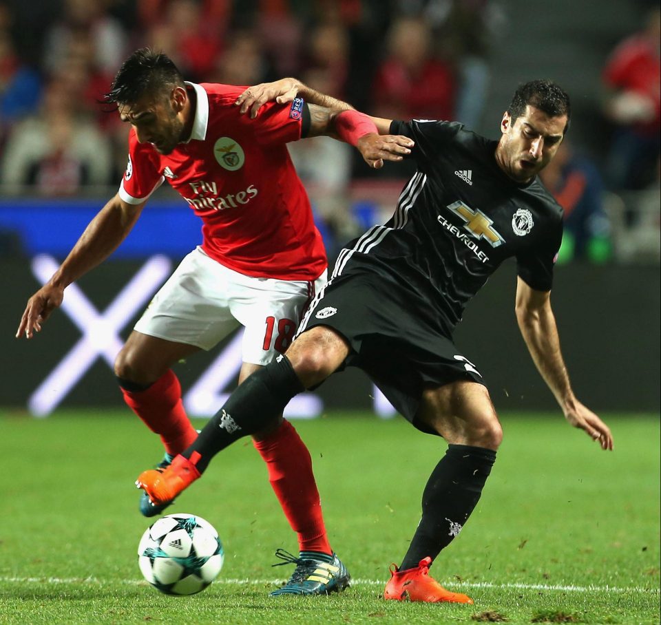  Mkhitaryan in action against Eduardo Salvio of Benfica