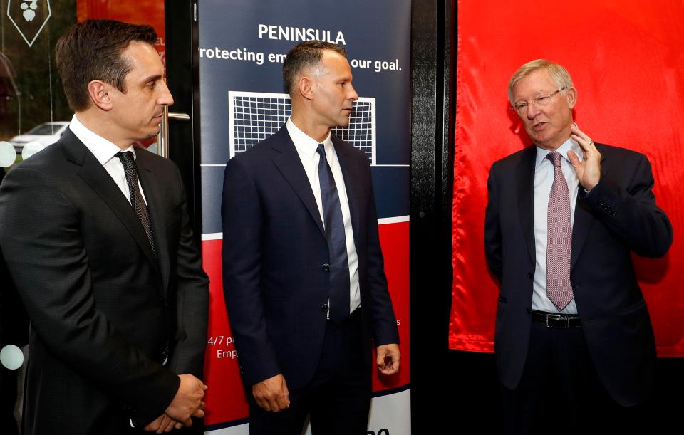  Gary and Neville and Ryan Giggs chat with their former United boss at The Peninsula Stadium